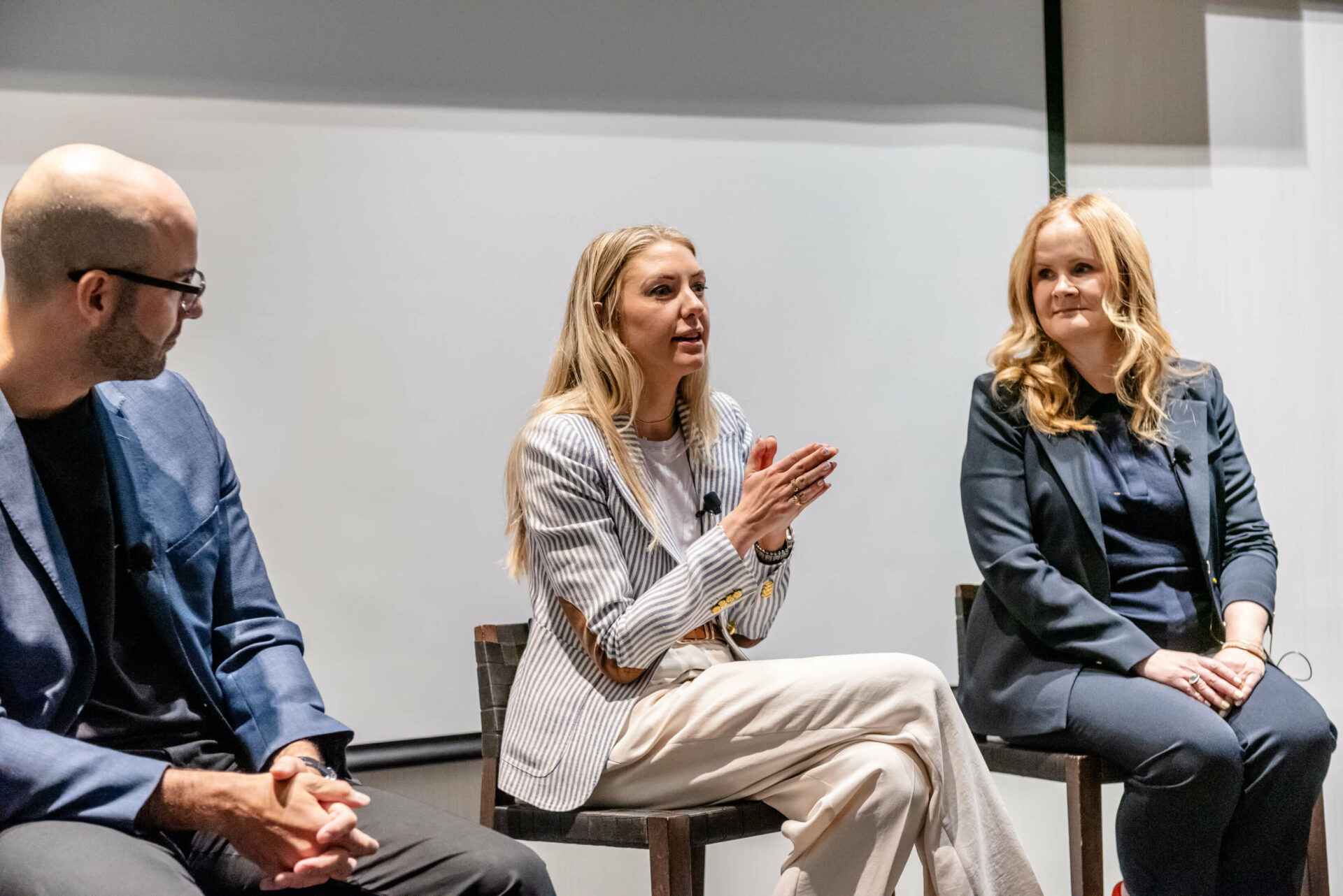 Photo of Nuno Bamberg, Christina Litz, and Jessica Gale seated on stage at the C-Suite Marketing Summit.
