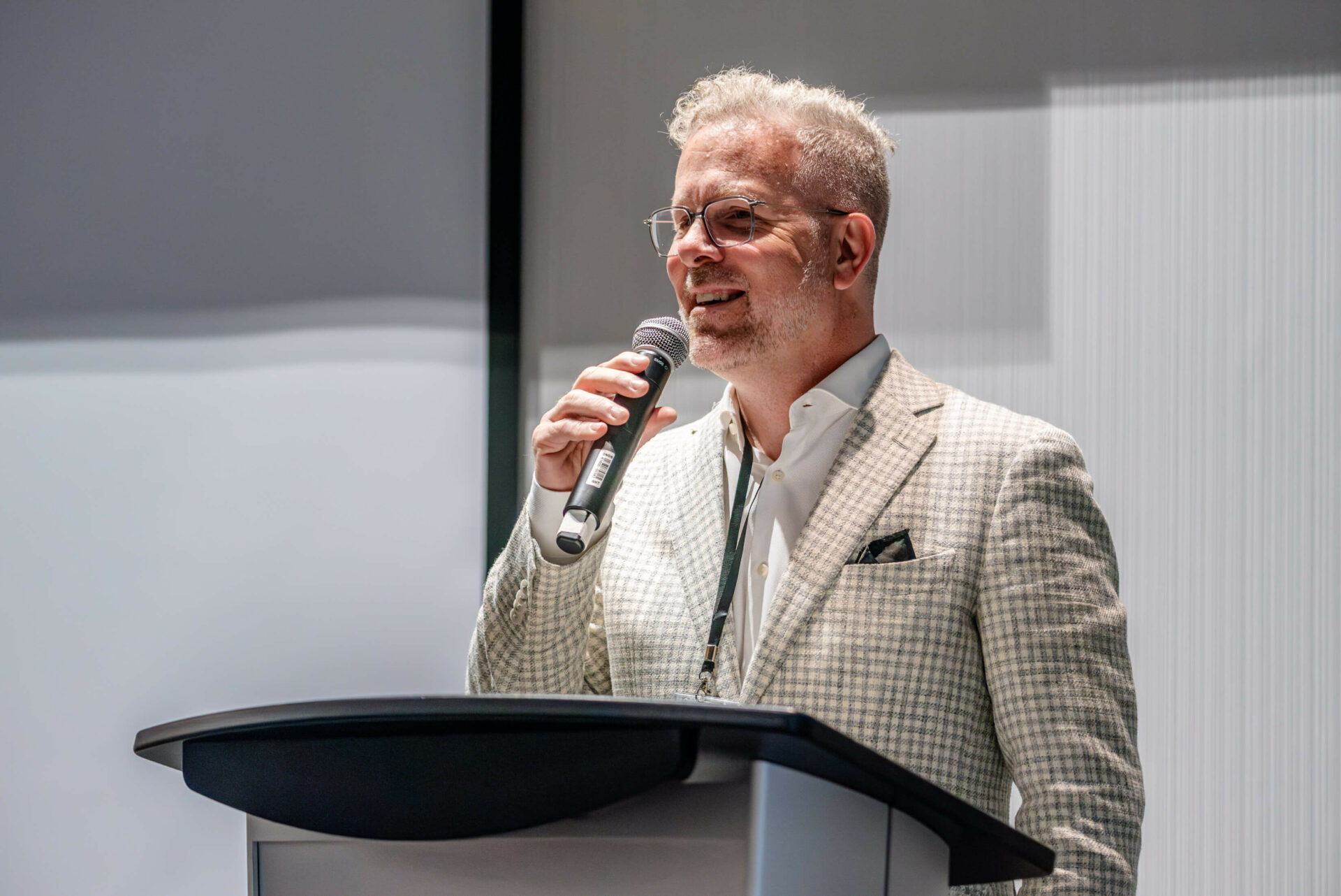 Photo of Christian Quenneville addressing the audience at the C-Suite Marketing Summit.